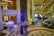 A luxurious celebration setting with guests enjoying live saxophone music.