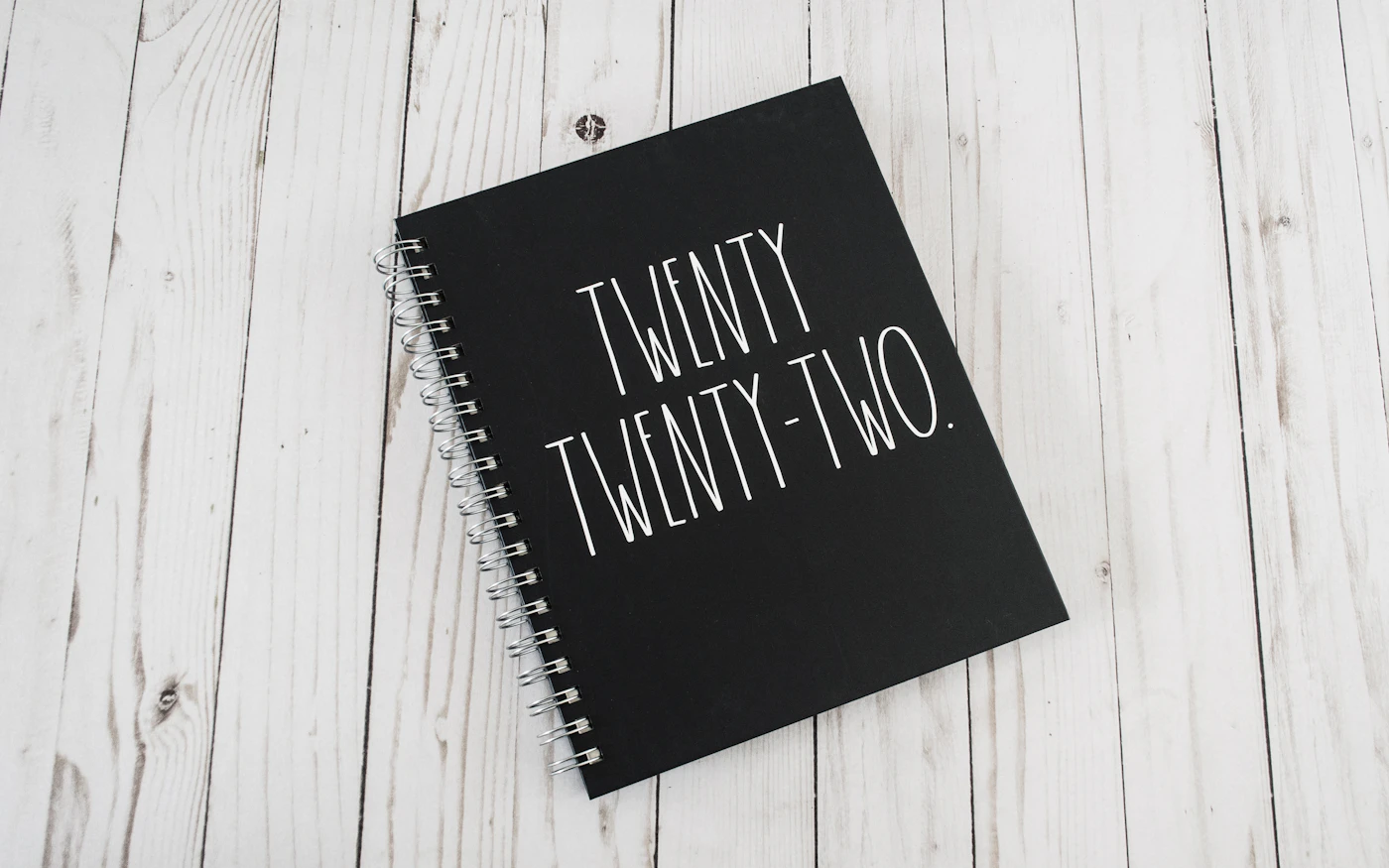 Open annual planner notebook — the kind of long-view schedule SMS automation runs on
