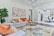 A beautifully renovated living room with modern furniture and fresh paint.