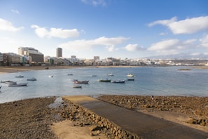 a group of boats floating on top of a body of water