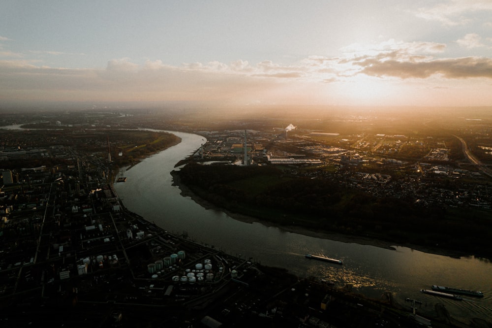 an aerial view of a river and a city