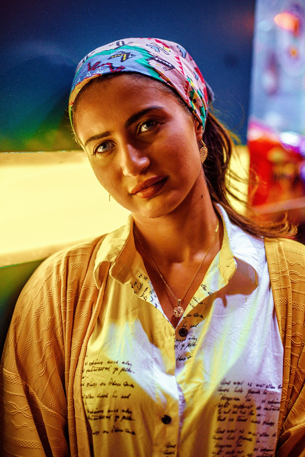 a woman with a bandana on her head