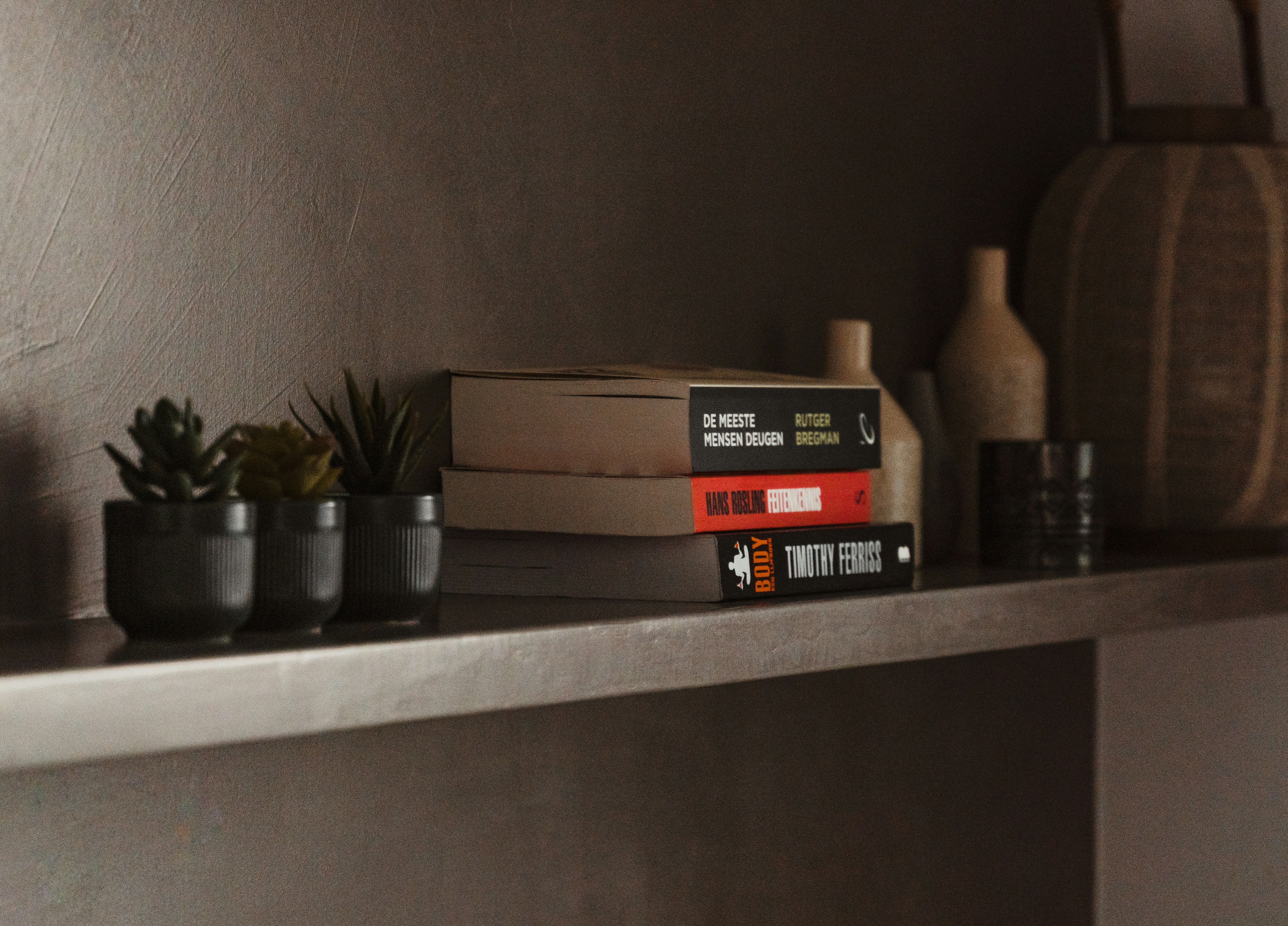  A top-down flat lay shot showcasing essential smart home devices including a smart plug, smart light bulb, smart speaker, and smart security camera, neatly arranged on a clean background.
