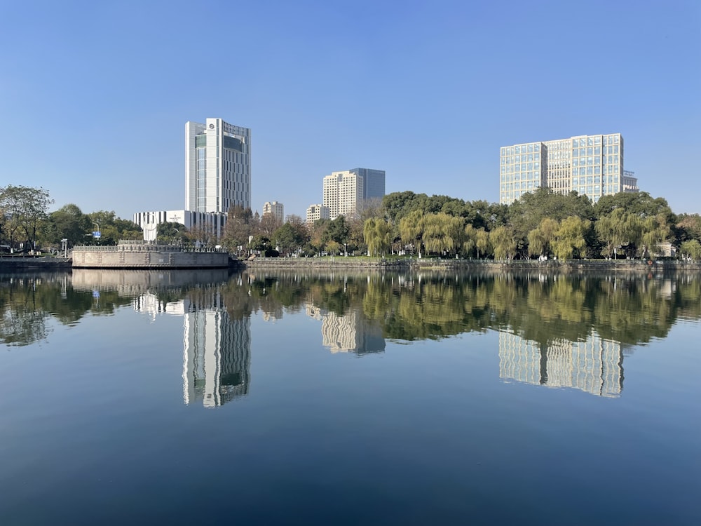 a body of water with buildings in the background