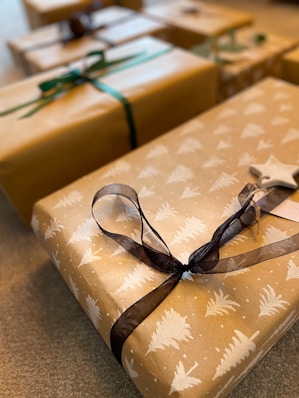 a couple of wrapped presents sitting on top of a table