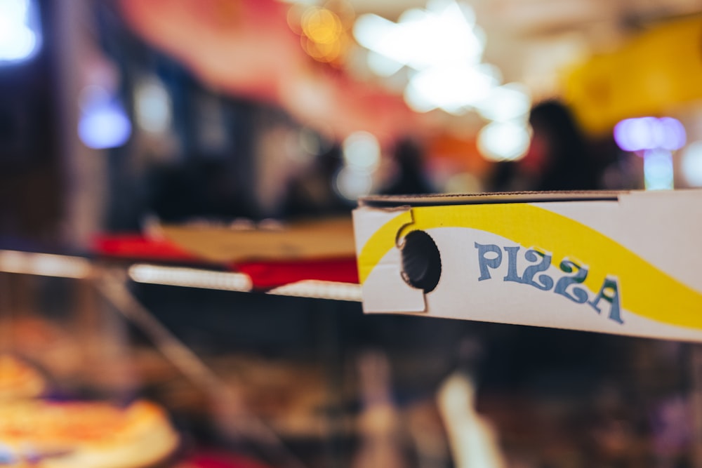 a close up of a pizza box on a table