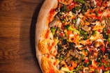 A gourmet vegetarian pizza with colorful vegetables.