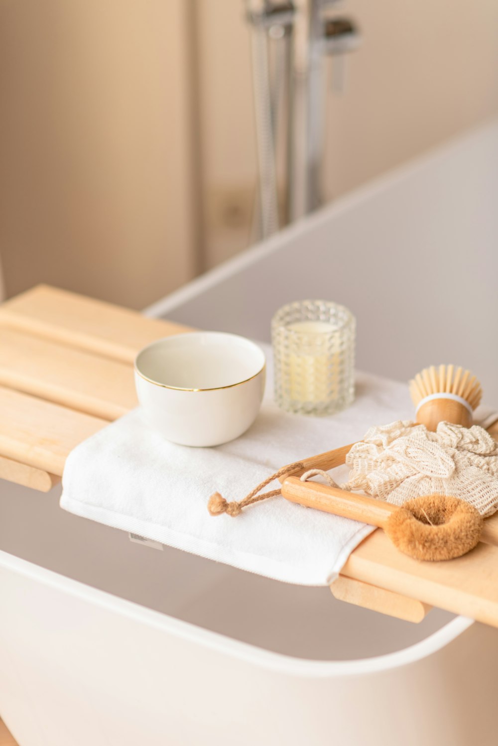 a white bowl sitting on top of a wooden table