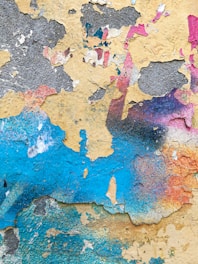 Close-up of textured wall showcasing unique patterns and vibrant paint colors.