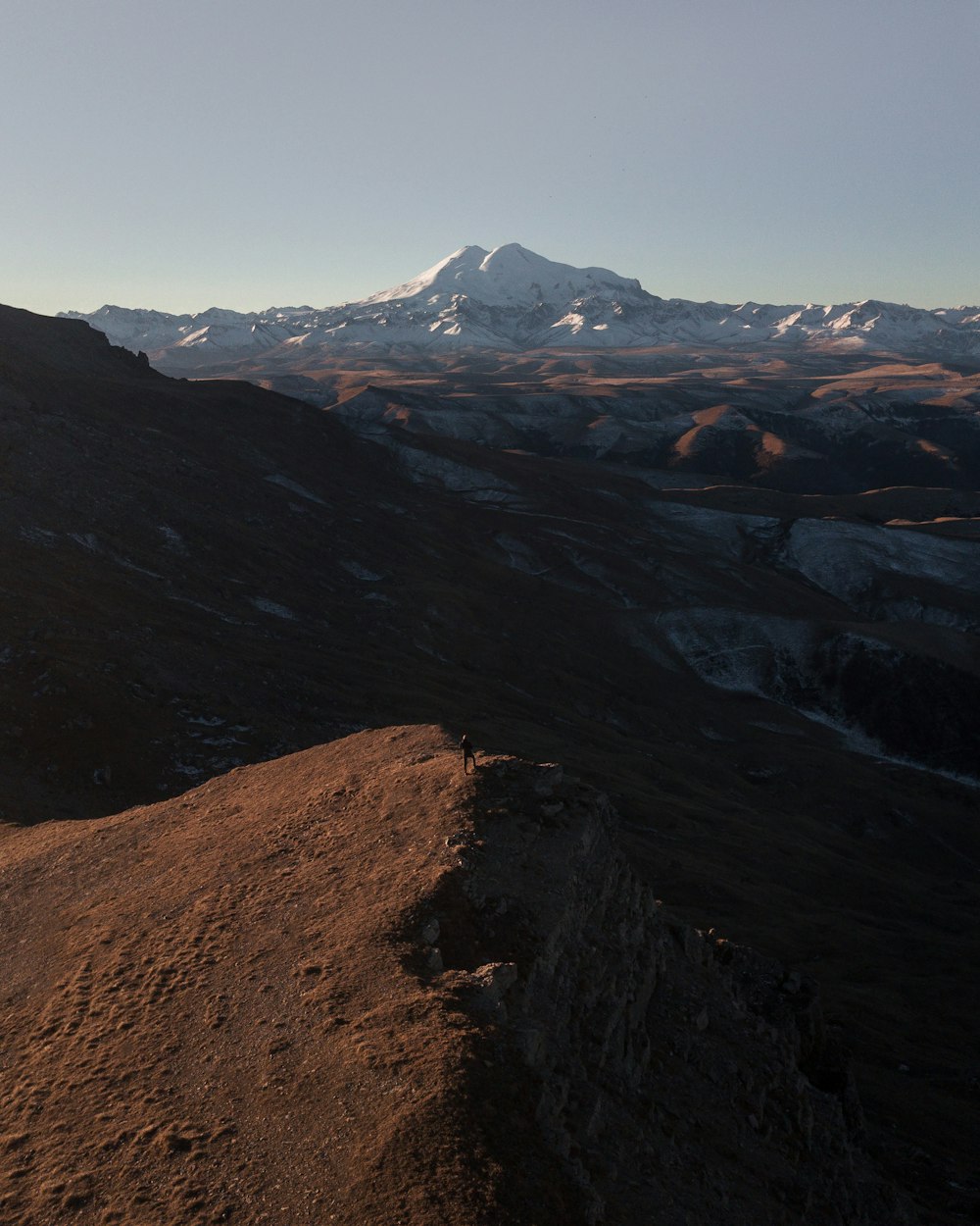 a person standing on top of a mountain