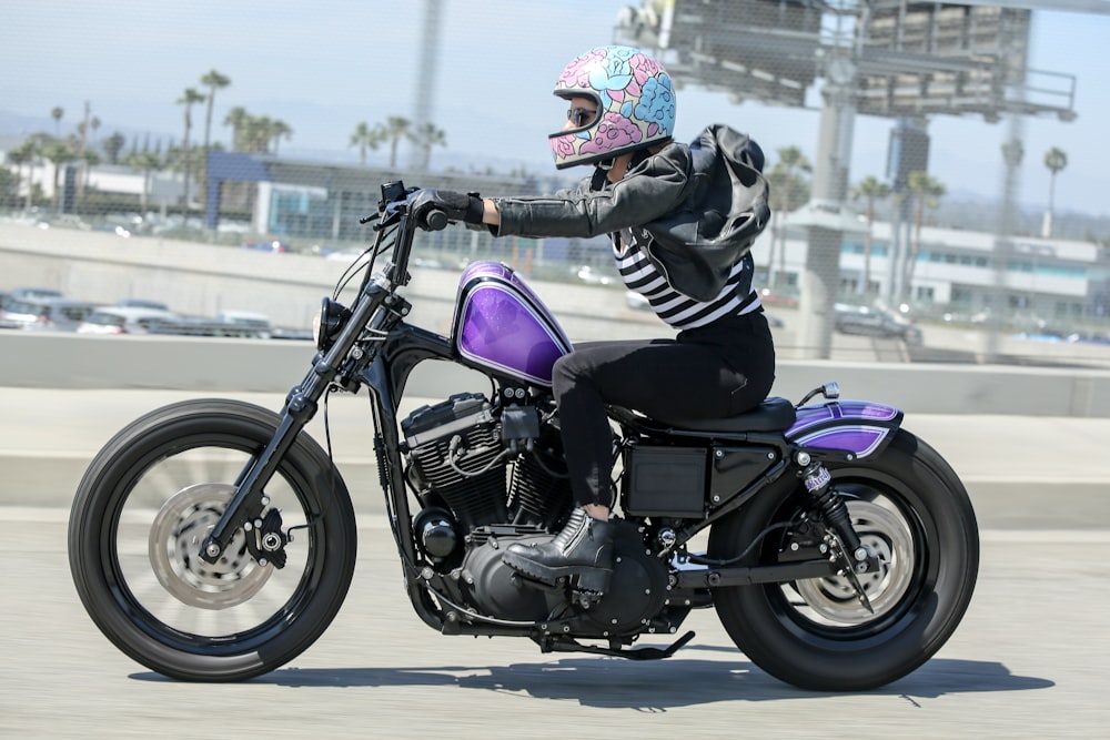 a person riding a motorcycle on a city street