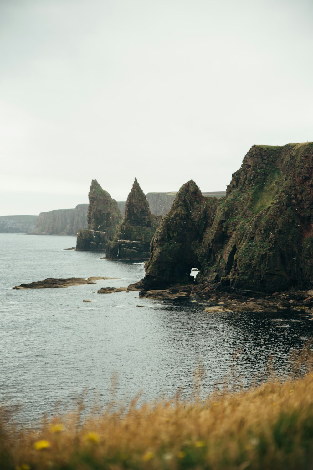 a body of water surrounded by rocky cliffs