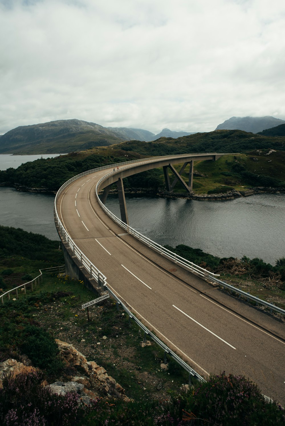 a highway going over a bridge over a body of water
