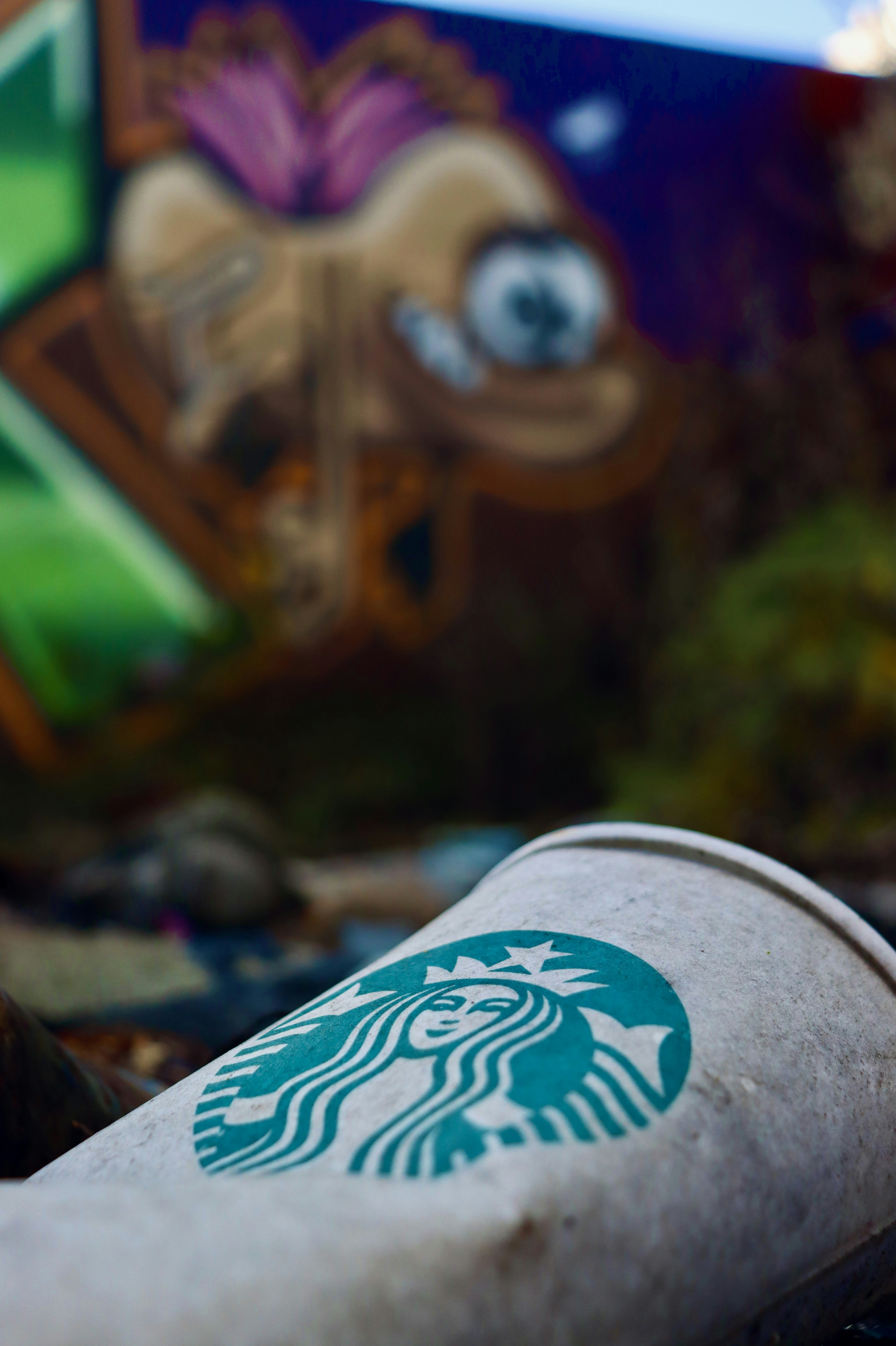 a starbucks cup sitting on top of a table