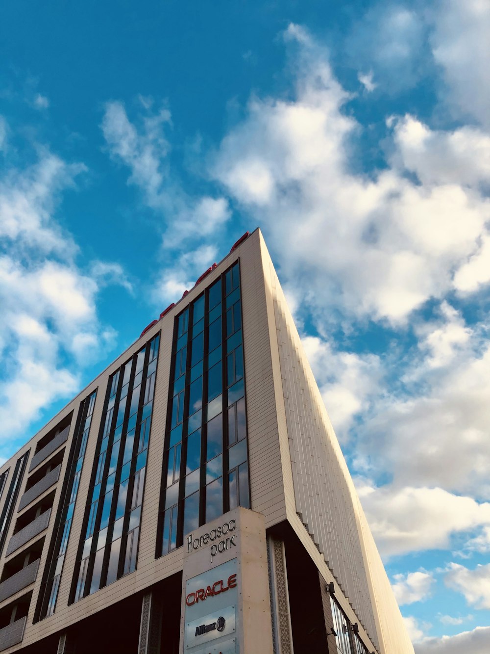 a tall building with a sky in the background