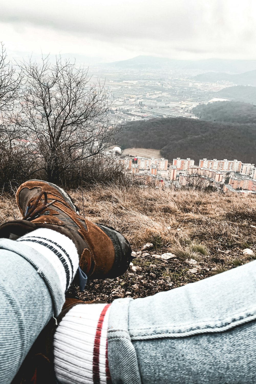 a person with their feet up on the ground