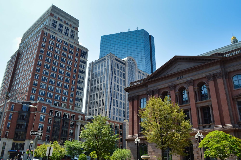 a group of tall buildings sitting next to each other