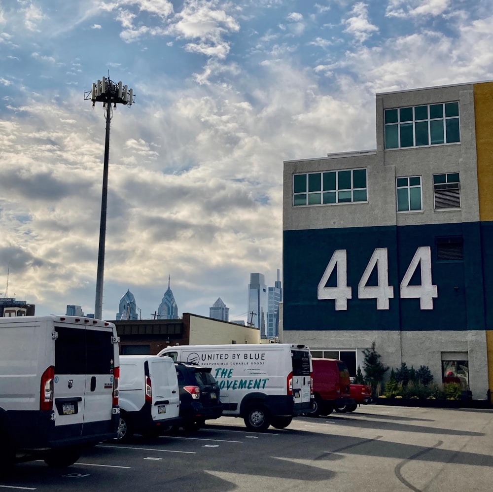 a group of trucks parked in front of a building