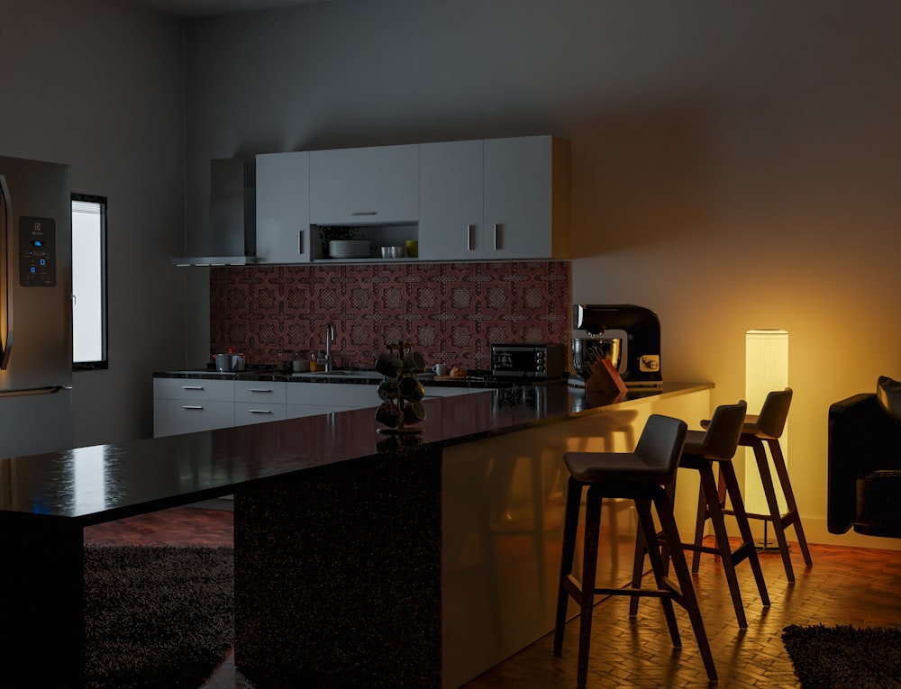 a dimly lit kitchen with a bar and stools