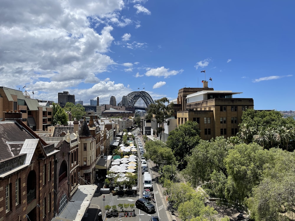 a view of a city with a bridge in the background