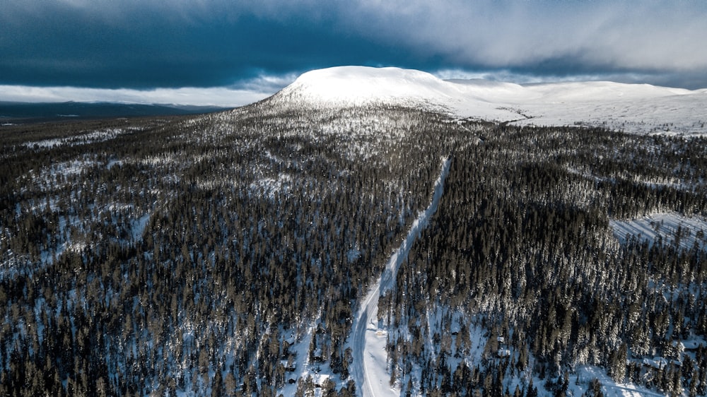 an aerial view of a snow covered mountain