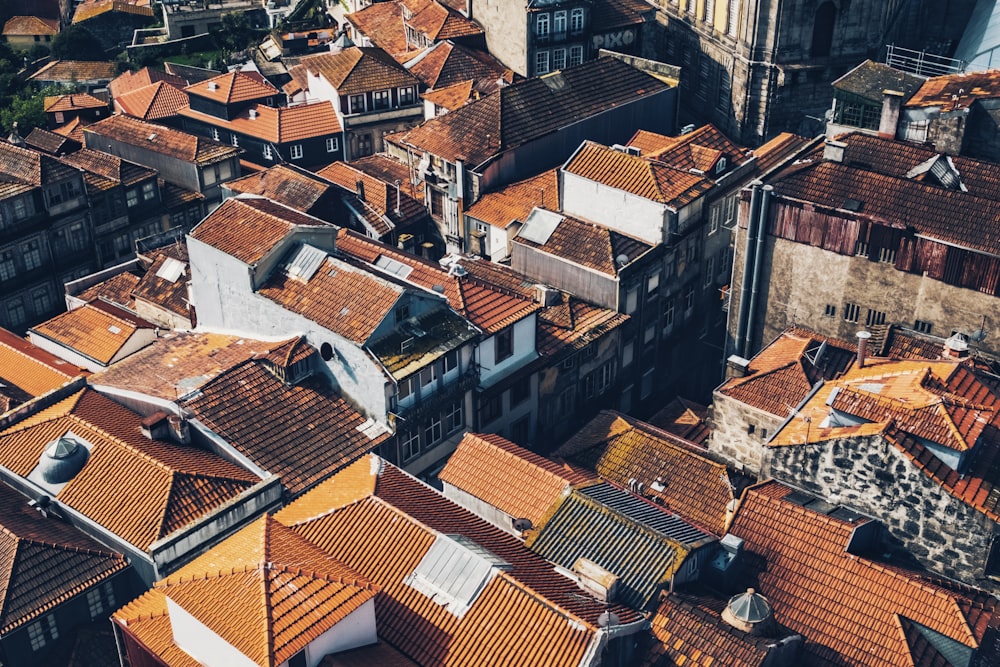 an aerial view of rooftops and buildings in a city