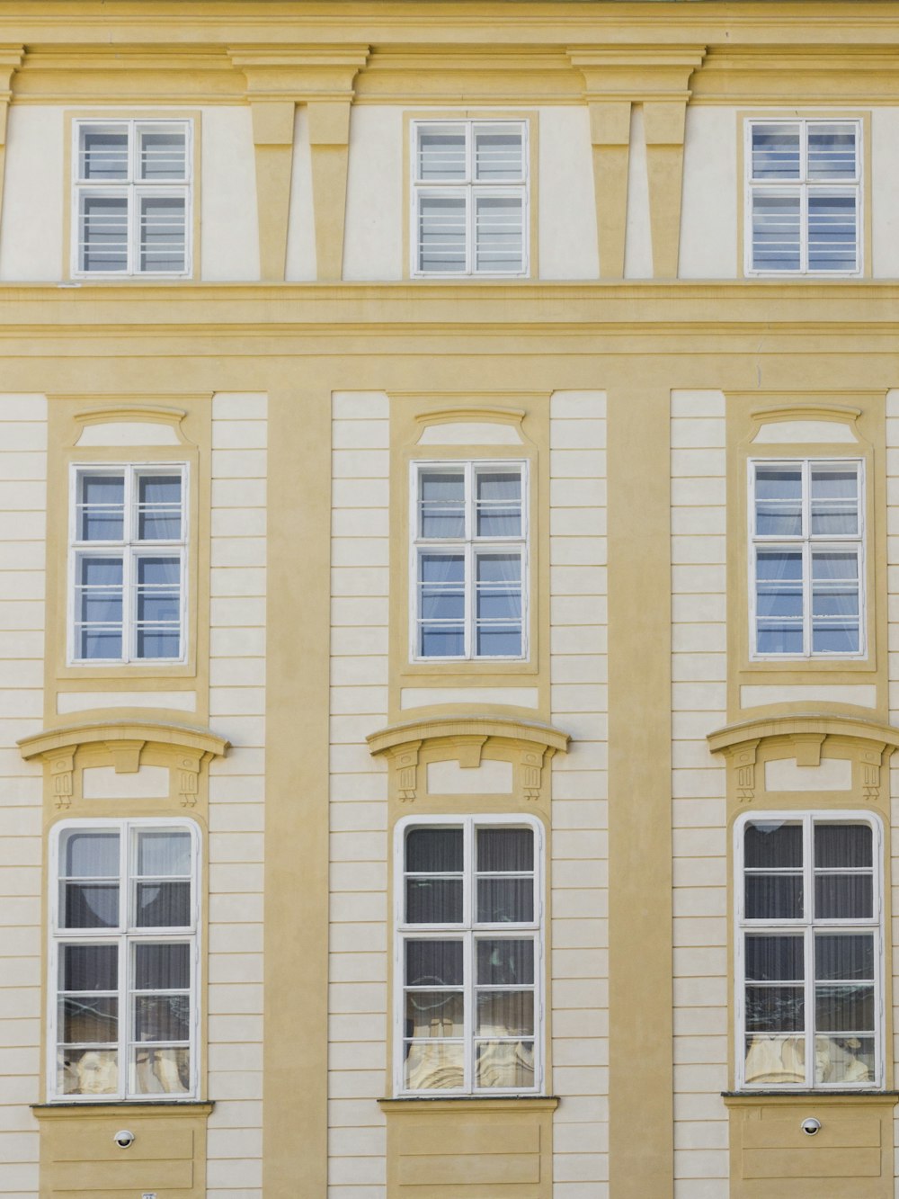 a building with windows and a clock on the front of it