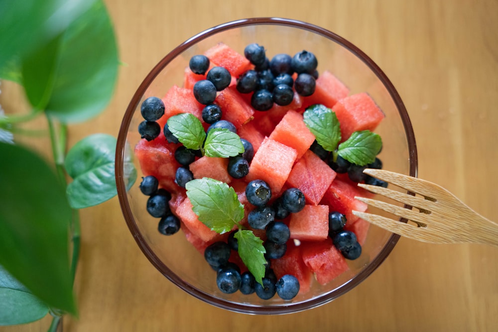 a bowl of watermelon, blueberries and mint