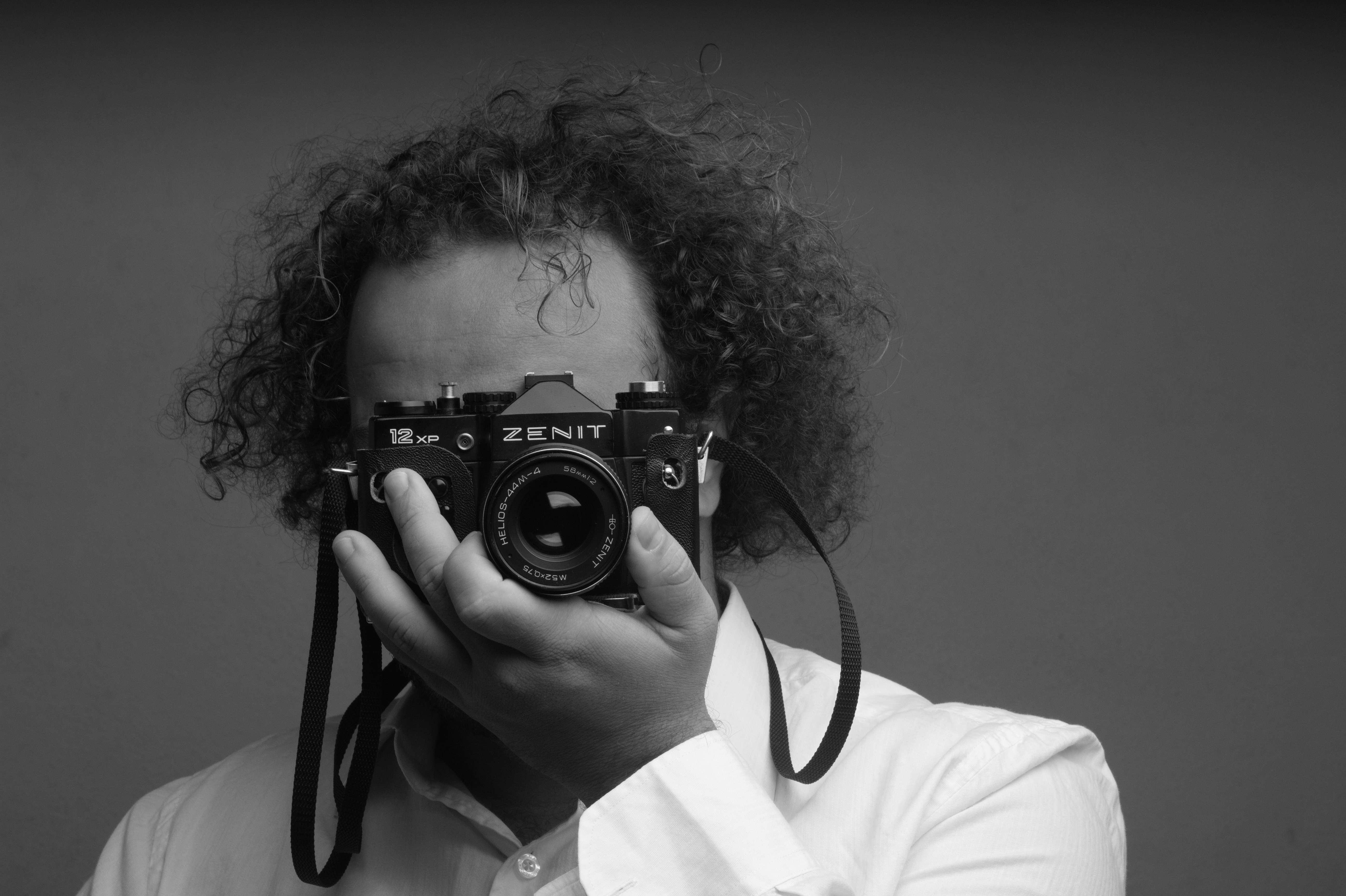 a person holding a camera up to their face