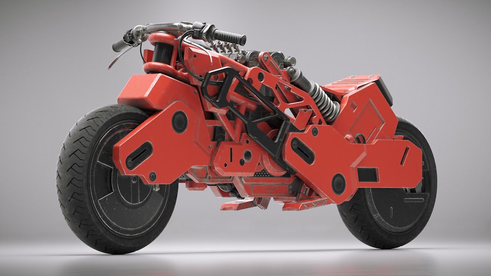 a red and black motorcycle on a gray background