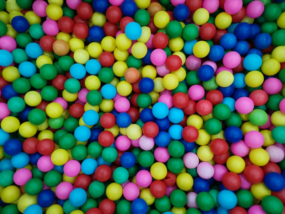 a bunch of colorful balls in a pile