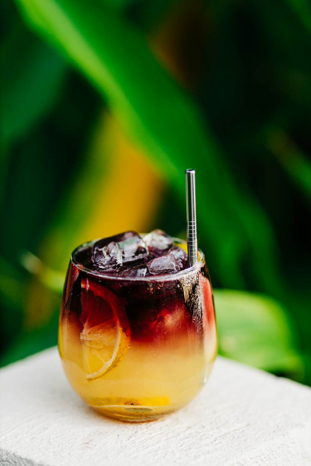 a drink with a straw in it sitting on a table