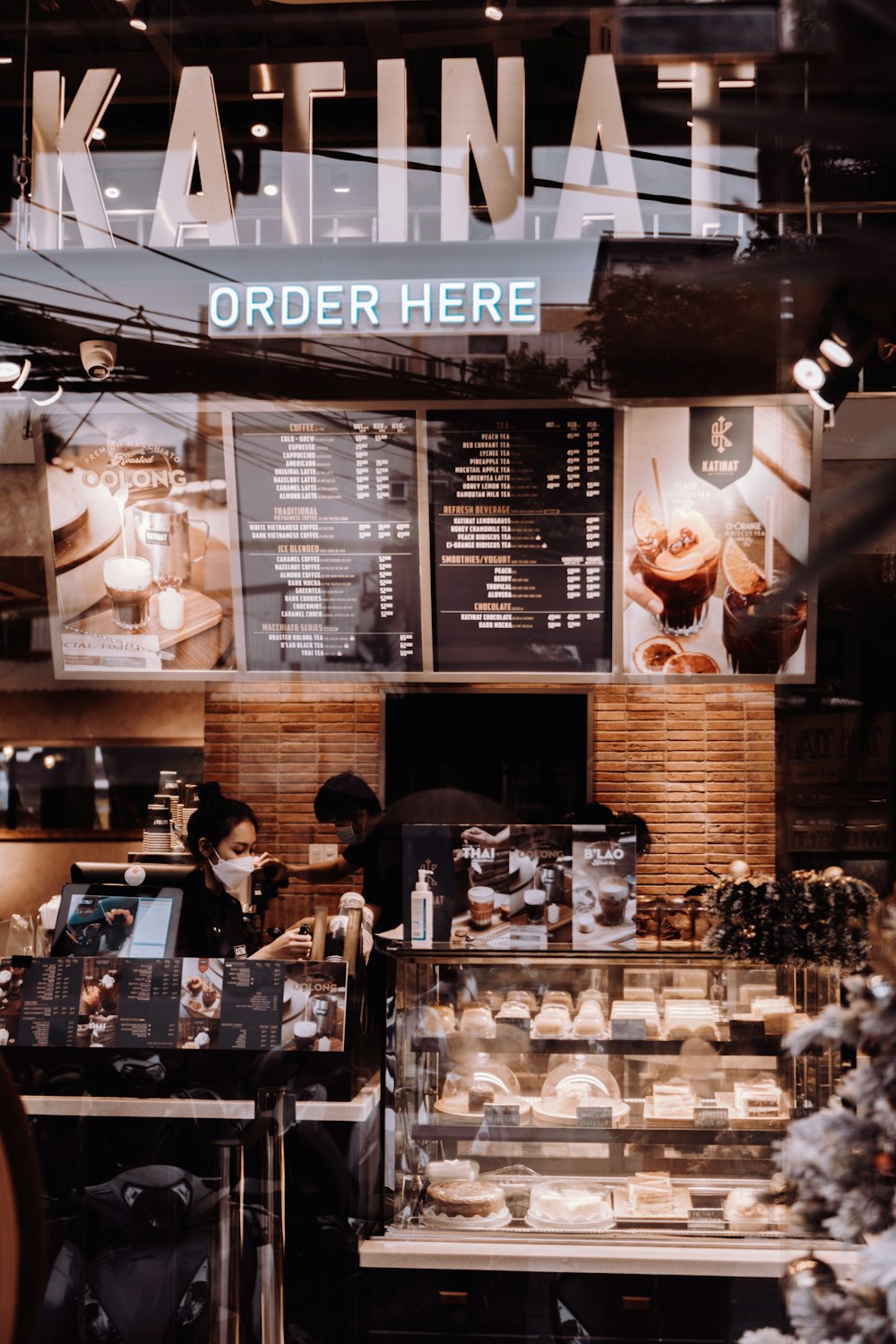 a person standing behind a counter in a store