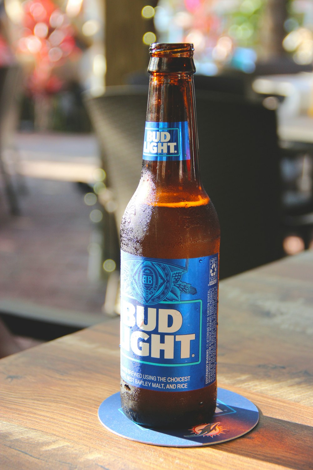 a beer bottle sitting on top of a wooden table