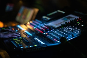 a dj mixing a track in a dark room