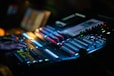 a dj mixing a track in a dark room