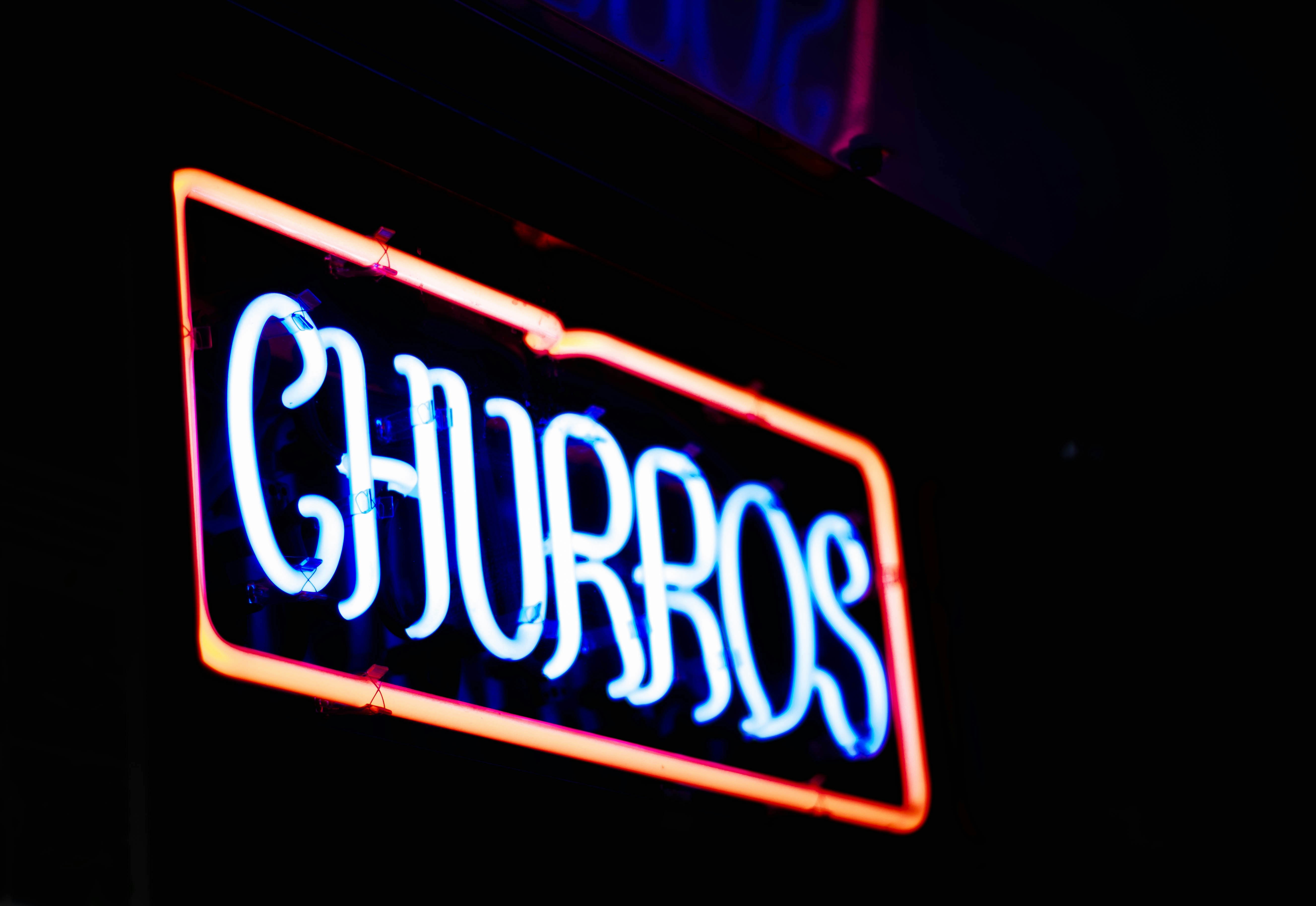 a neon sign with the word chaos on it