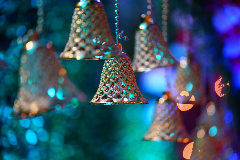 a group of bells hanging from a ceiling