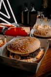 two hamburgers and fries are sitting on a table