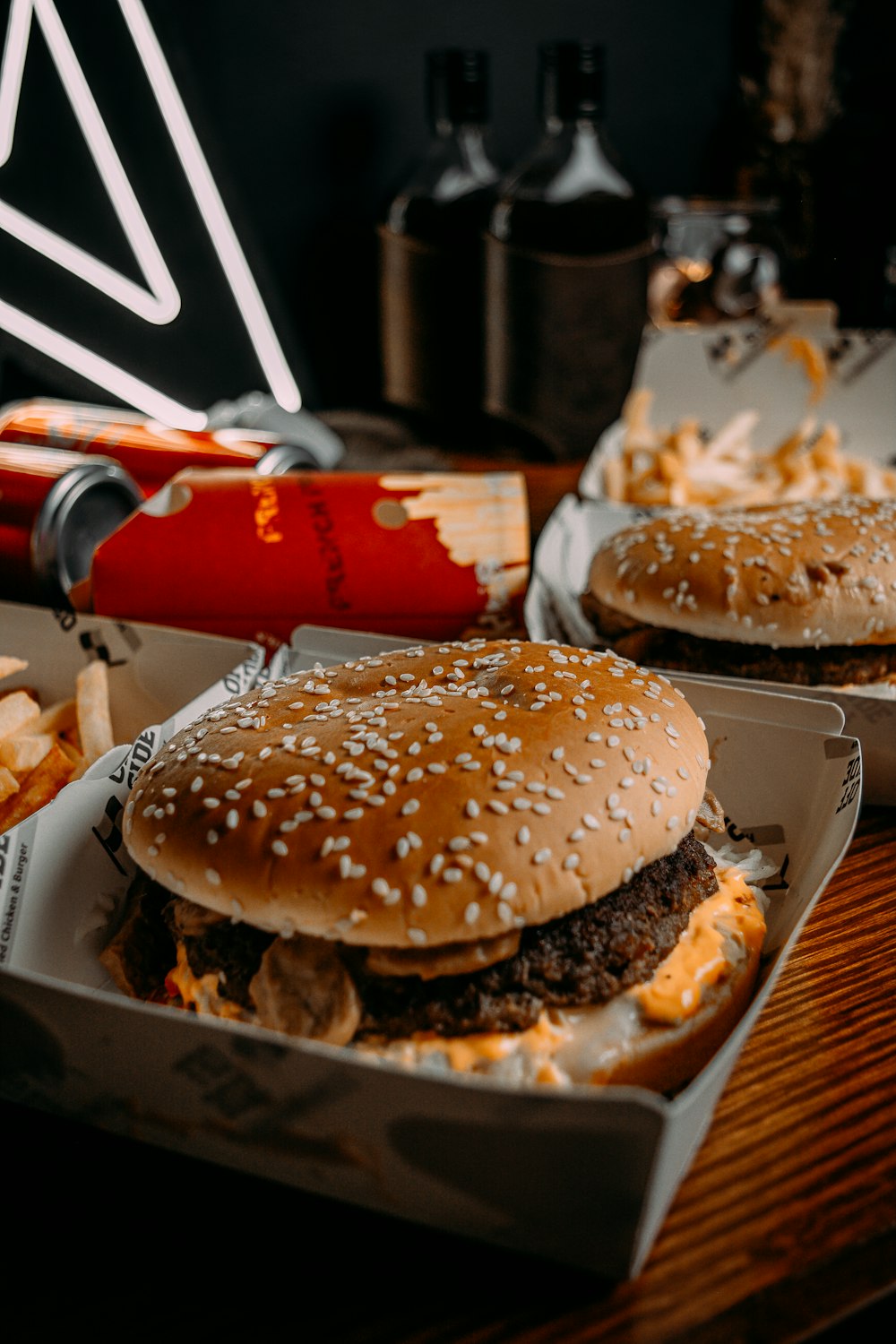 two hamburgers and fries are sitting on a table