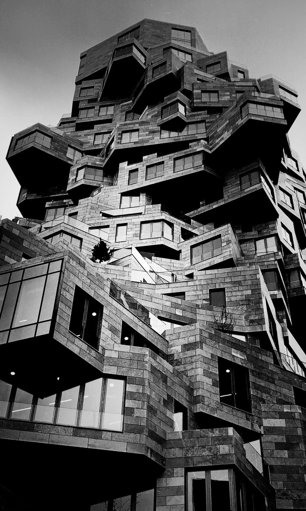 a black and white photo of a very tall building