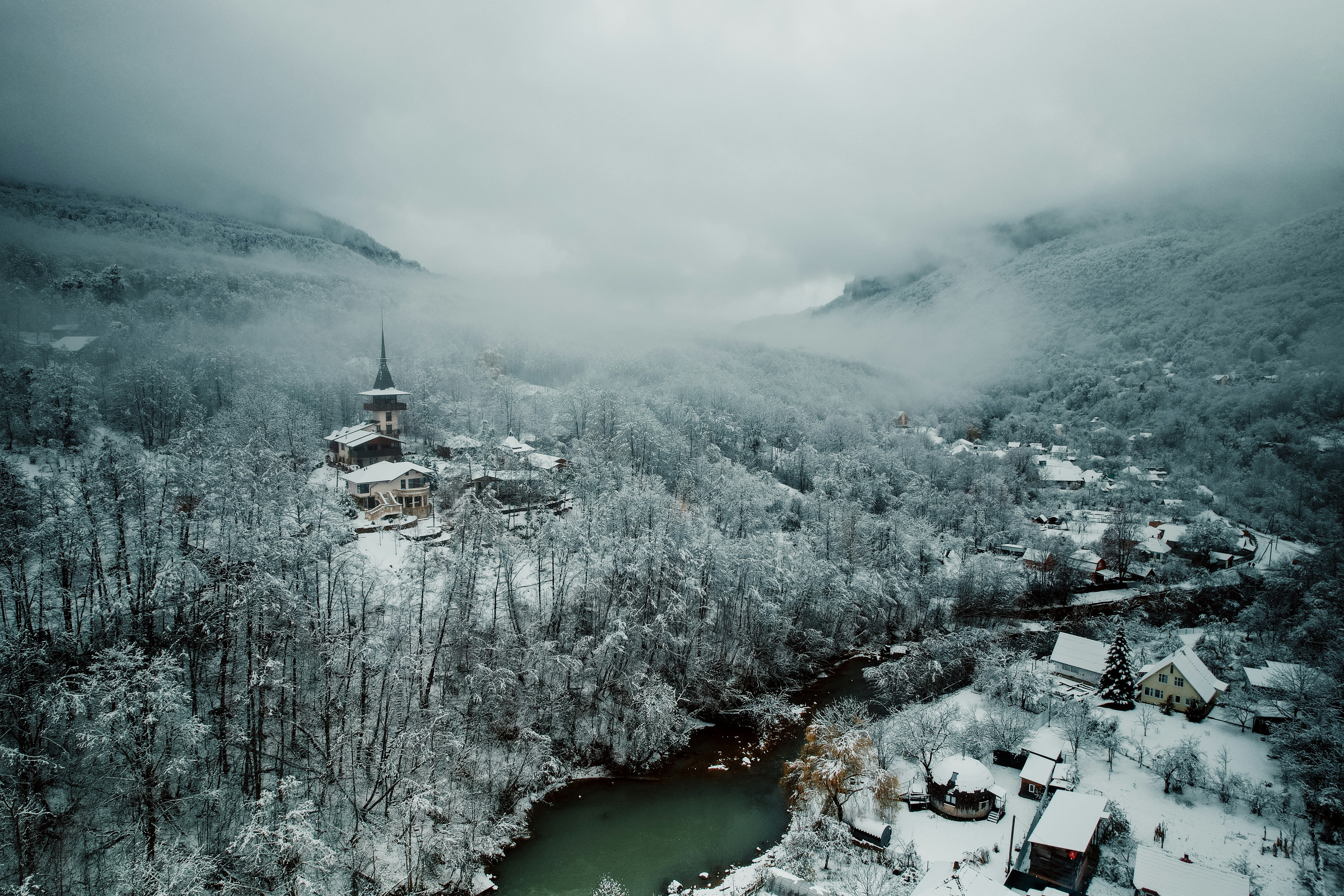 an aerial view of a village in the mountains