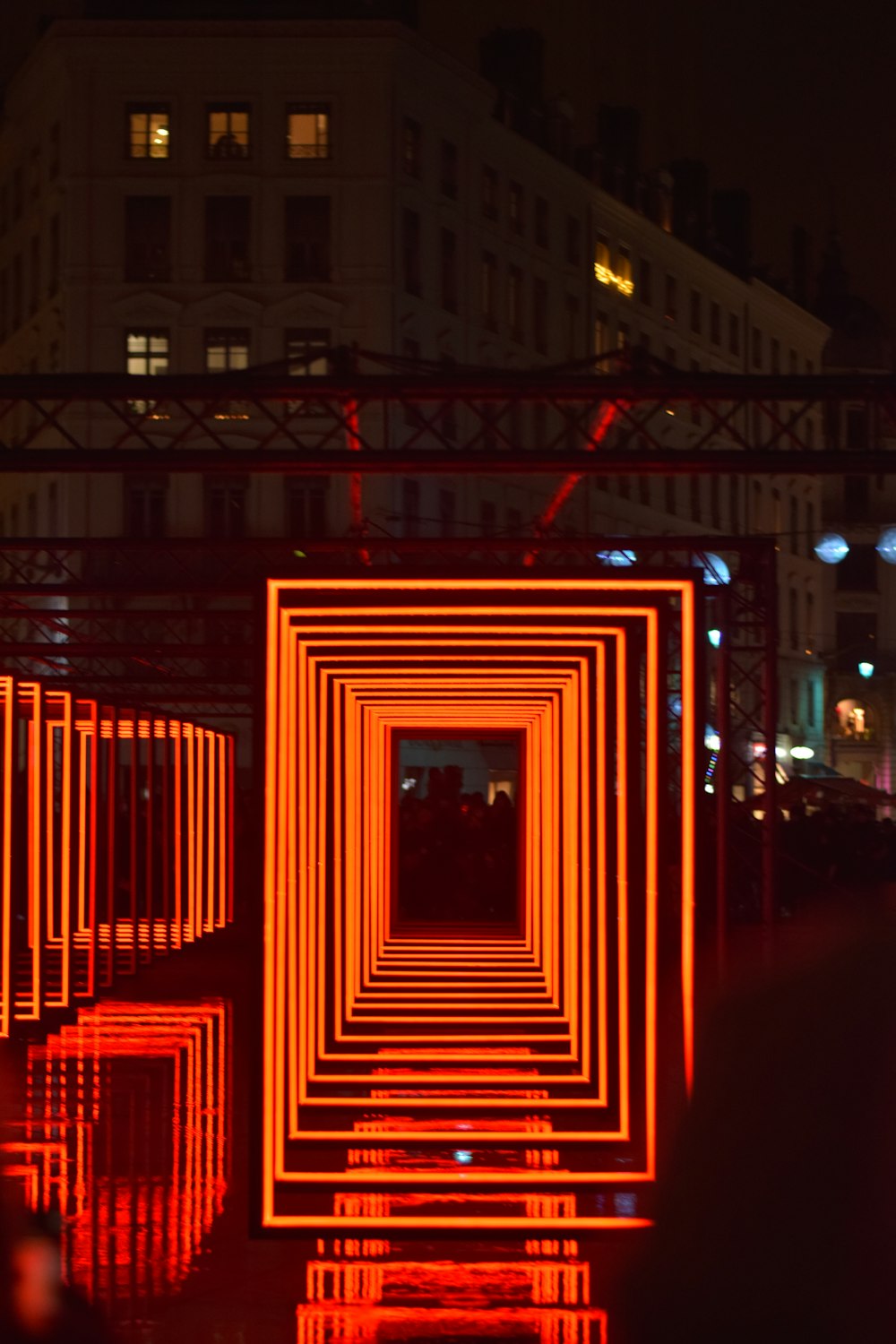 a long tunnel of red lights in the middle of a street