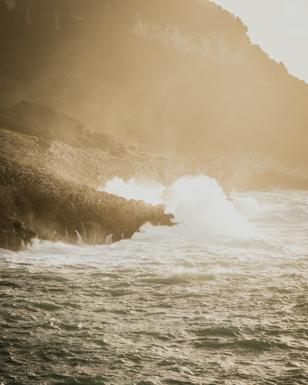 a person riding a surfboard on top of a wave