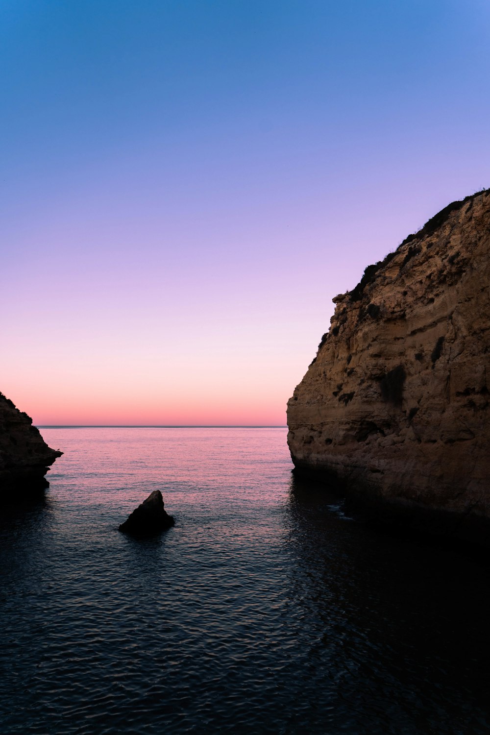 a body of water that has some rocks in it