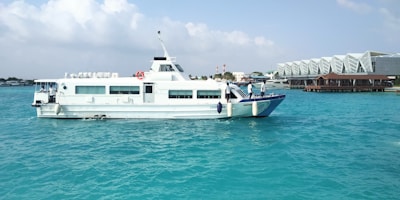 a large white boat floating on top of a body of water