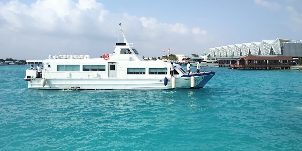 a large white boat floating on top of a body of water