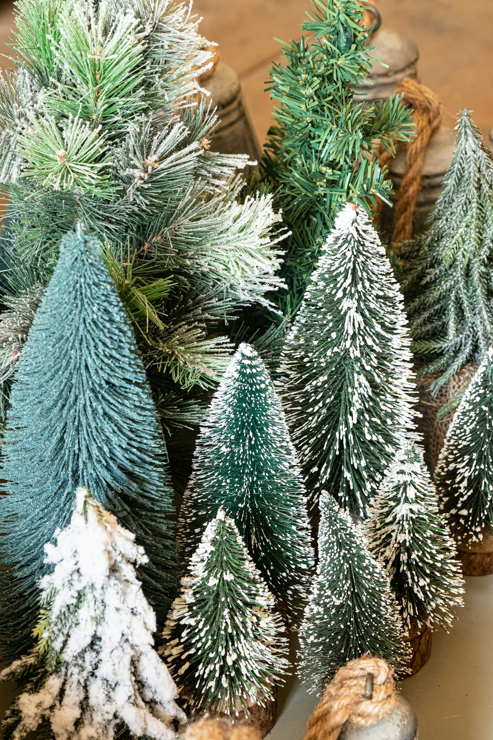 a group of small christmas trees sitting on top of a table