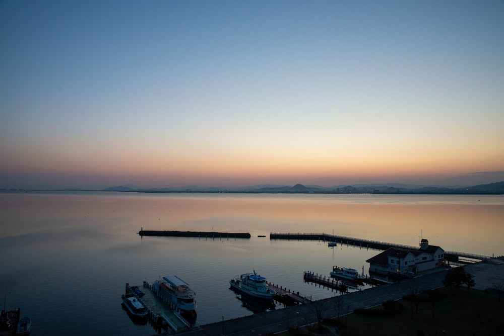 a group of boats that are sitting in the water