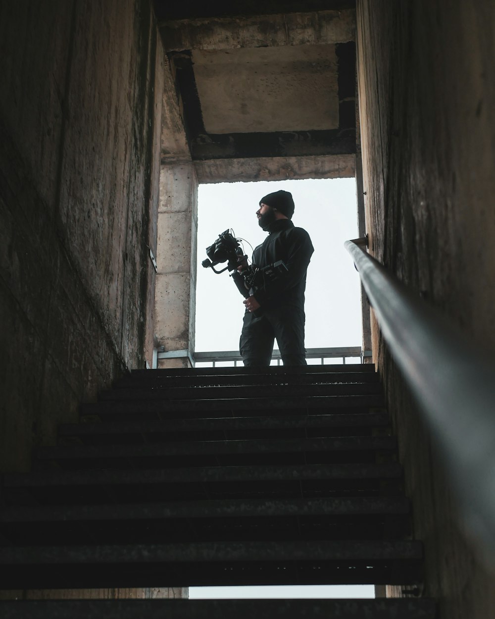 a man standing on top of a set of stairs